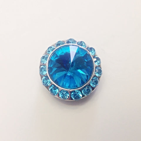 Silver coloured round with small blue rhinestone surround and one large blue rhinestone in centre 18 mm snap